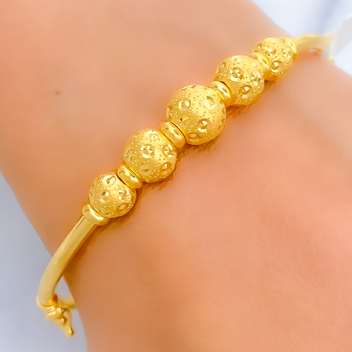 Graceful Graduated Orb Bangle Bracelet