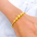 Graceful Graduated Orb Bangle Bracelet