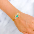  18k-gold-floral-emerald-diamond-bangle-bracelet