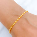 Ritzy Classic Gold Bracelet with Heart Charm