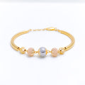 Impeccable Two-Tone Sequin 22k Gold Bangle Bracelet