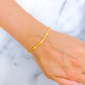 22k-gold-Glistening Curved Gold Bracelet