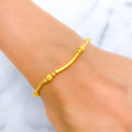 22k-gold-Glistening Curved Gold Bracelet