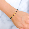 22k-gold-tasteful-black-bead-bracelet