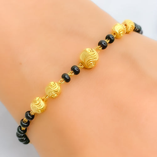 22k-gold-dazzling-black-bead-bracelet