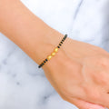 22k-gold-engraved-black-bead-bracelet