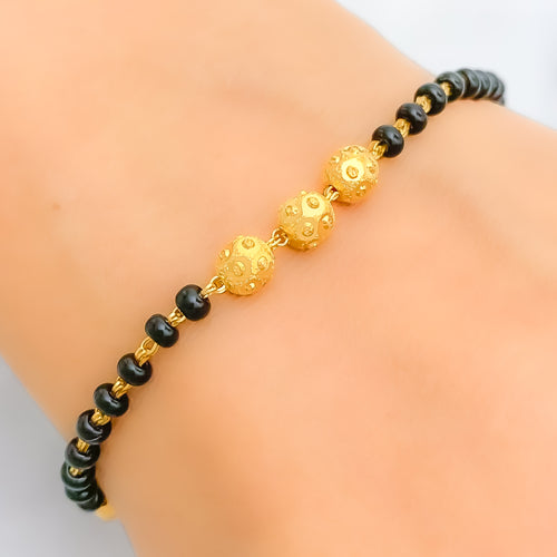 22k-gold-engraved-black-bead-bracelet