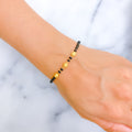 22k-gold-dainty-black-bead-bracelet