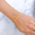 Glittering Orb Black 22k Gold Bead Bracelet