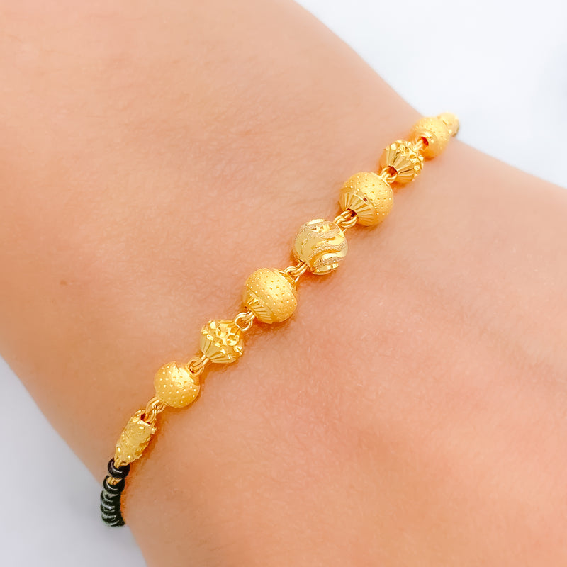 Glittering Orb Black 22k Gold Bead Bracelet