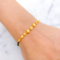 Glittering Orb Black 22k Gold Bead Bracelet