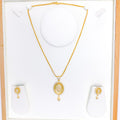 Upscale Oval Halo 22k Gold Pendant Set