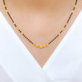 Sleek Black Bead 22k Gold Necklace