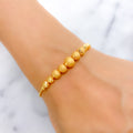 Sophisticated Dual Finish 22k Gold Orb Bracelet