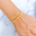 Dressy Graduated Orb 22k Gold Bracelet