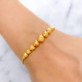 Dressy Graduated Orb 22k Gold Bracelet