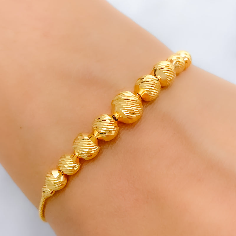 Dressy Graduated Orb 22k Gold Bracelet