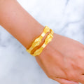Contemporary Sand Finish Wave 22k Gold Bangles