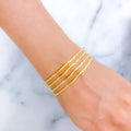 Dainty Evergreen Machine 22k Gold Cut Bangles