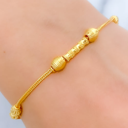 Sleek Striped Orb 22k Gold Bracelet