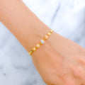 Impeccable Two-Tone Sequin 22k Gold Bangle Bracelet