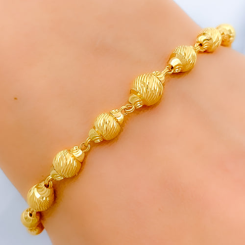 High Polish Striped 22k Gold Orb Bracelet