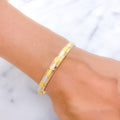 Elevated Two-Tone Alternating 22k Gold Oval Bangle
