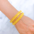 Upscale Radiant Flower-Lined 22k Gold Bangles