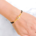 Floral Meenakari Black Bead 22k Gold Bracelet