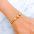 Graceful Dotted Three-Tone 22k Gold Bangle Bracelet