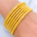 Iconic Reflective Gold Bangles