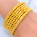 Iconic Reflective Gold Bangles