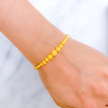 Graduating Sand Finish Orb 22k Gold Bracelet