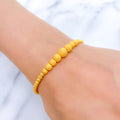 Graduating Sand Finish Orb 22k Gold Bracelet