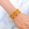 Vibrant Floral 22k Gold Lakshmi Bangles