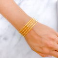 Radiant High Finish Set of 4 22k Gold Bangles