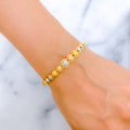 22k-gold-grand-orb-wire-bangle-bracelet