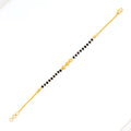 22k-gold-engraved-black-bead-bracelet