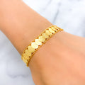21k-gold-dainty-hinged-coin-bracelet