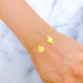 21k-gold-fancy-dangling-heart-charm-bracelet