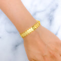 21k-gold-symmetrical-flowy-coin-bracelet