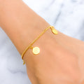 21k-gold-modest-hanging-coin-charm-bracelet