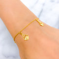21k-gold-reflective-heart-accented-charm-bracelet