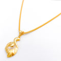 Graduated Spiral Leaf 22k Gold Pendant