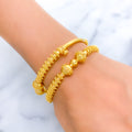 22k-gold-Extravagant Beaded Striped Bangles