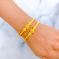 22k-gold-radiant-reflective-triple-orb-pipe-bangles