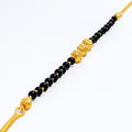 22k-gold-engraved-black-bead-bracelet