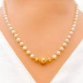 22k-gold-orb-accented-pearl-necklace