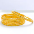 Iconic Reflective Gold Bangles