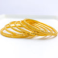 Iconic Reflective Gold Bangles